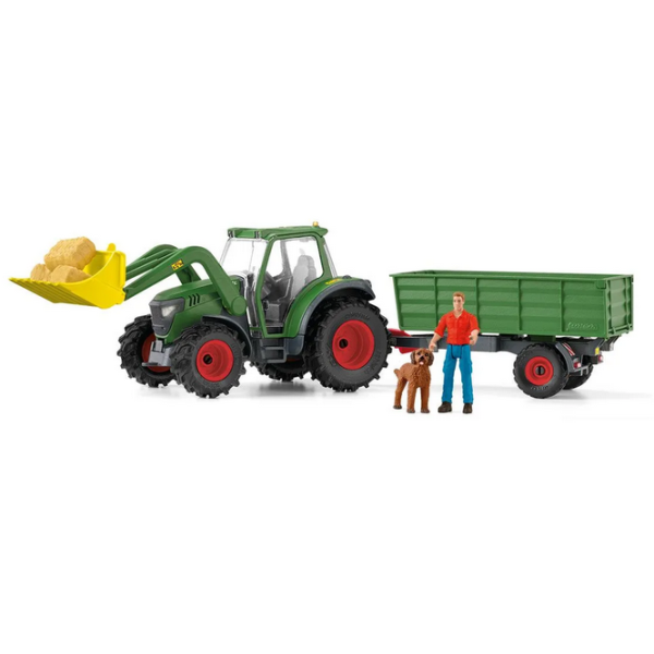 The Schleich 42608 FARM WORLD tractor with trailer, Farmer Paul, Goldendoodle and hay bales is shown as a detailed farm playset.